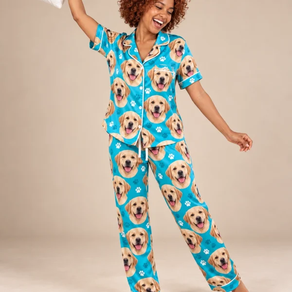Woman posing in labrador print pajamas, yellow Labrador Retriever faces on teal paw-print satin — MyDogPics