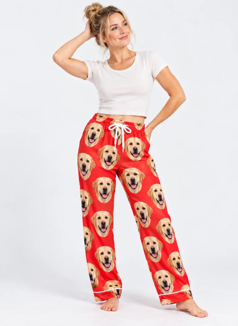Woman posing in labrador Valentine pajamas, yellow Labrador Retriever faces on red satin — MyDogPics