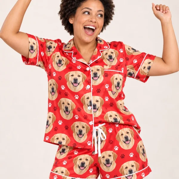 Woman posing in a labrador Valentines day pajama set, yellow Labrador Retriever faces on red paw-print satin — MyDogPics