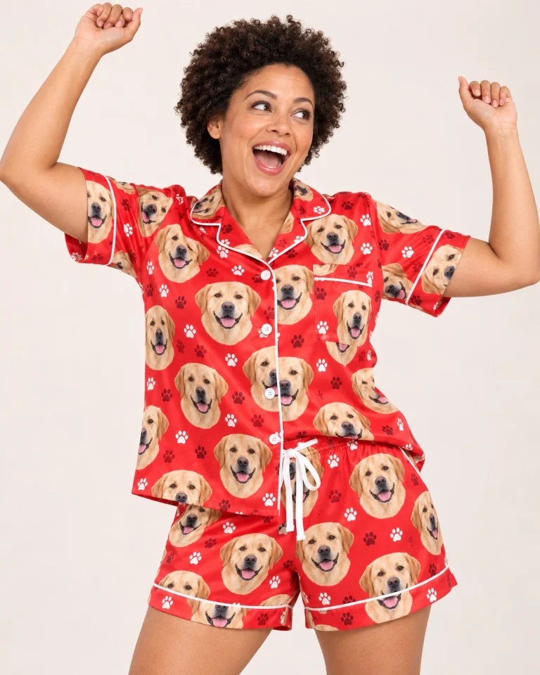 Woman posing in a labrador Valentines day pajama set, yellow Labrador Retriever faces on red paw-print satin — MyDogPics