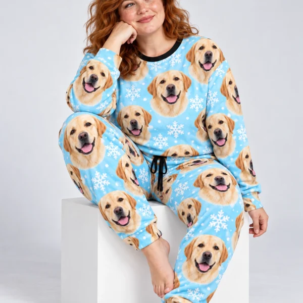 Woman sitting in labrador winter pajamas covered in yellow Labrador Retriever faces — MyDogPics