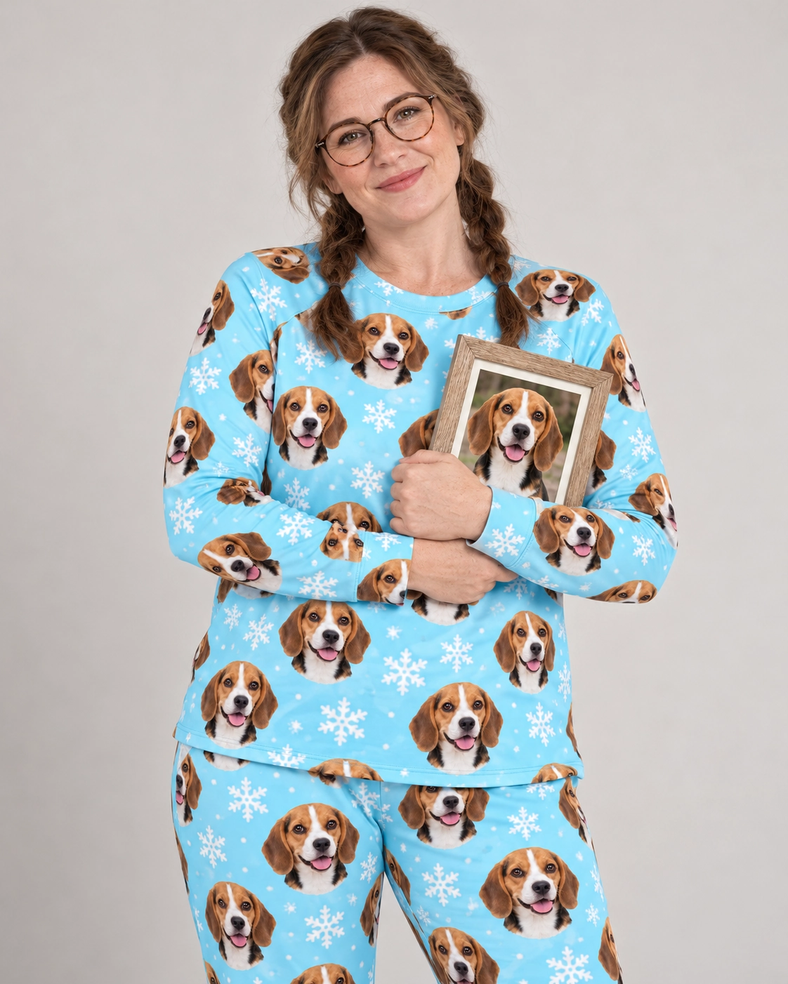 Matching Beagle Pajamas – Front View, Light Blue Snowflake | MyDogPics Woman wearing matching beagle pajamas covered in tricolor Beagle (black, tan and white) faces — MyDogPics