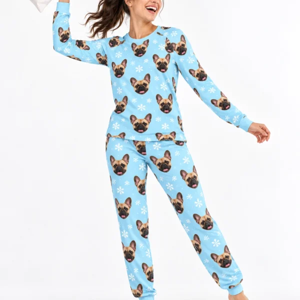 Woman posing in matching French bulldog pajamas, fawn French Bulldog faces on light blue snowflake fabric — MyDogPics