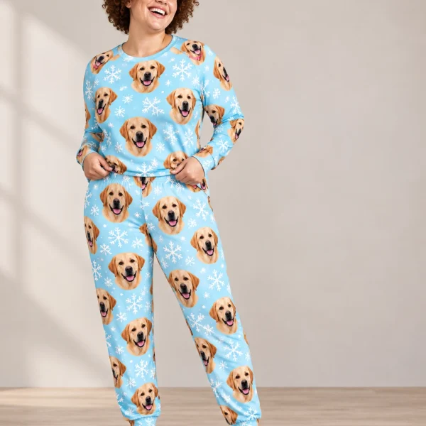 Woman wearing matching labrador pajamas covered in yellow Labrador Retriever faces on light blue snowflake fabric — MyDogPics