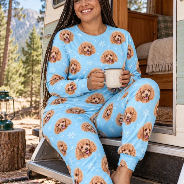 Woman sitting in matching poodle pajamas covered in apricot Poodle faces — MyDogPics