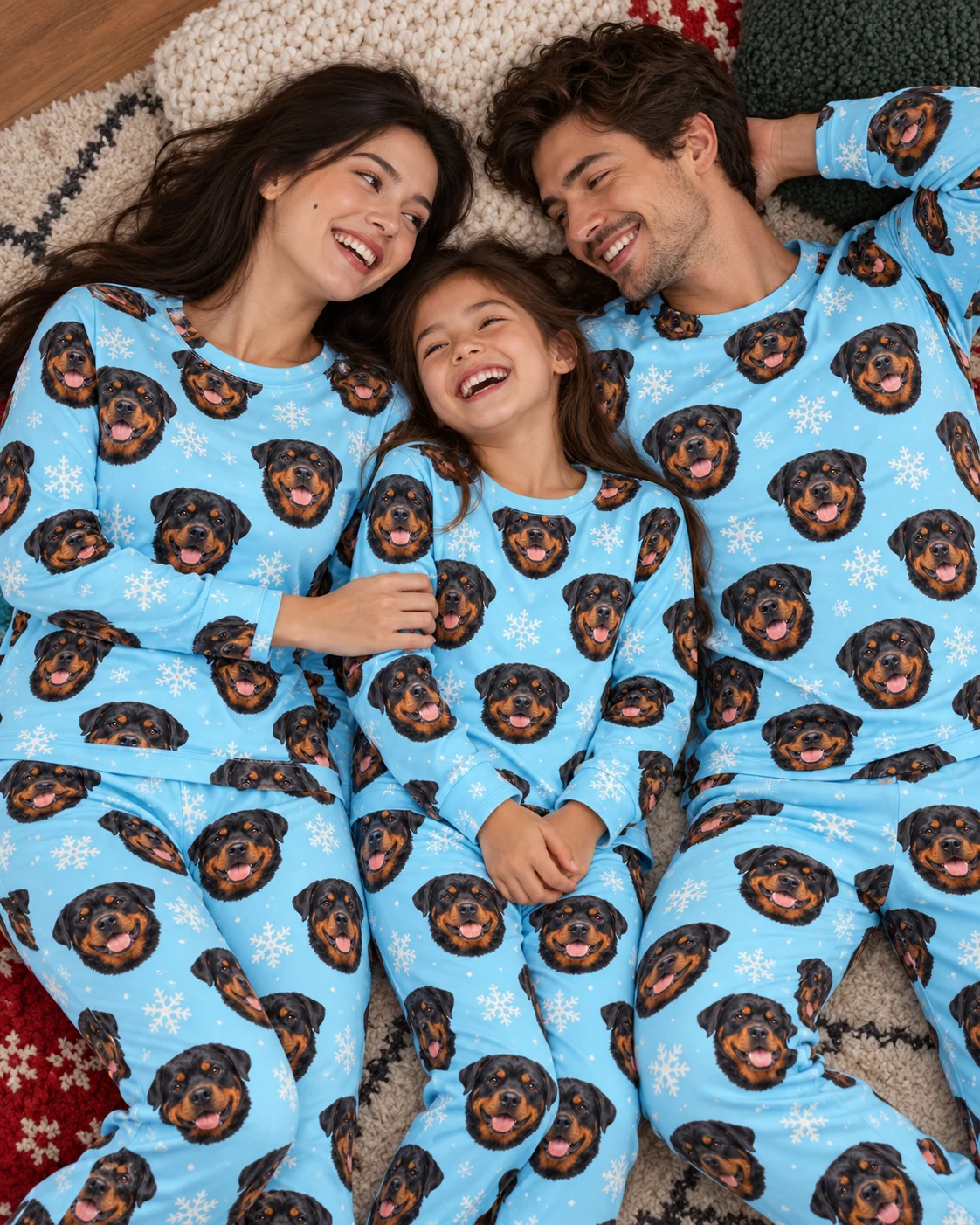 Matching Rottweiler Pajamas – Family, Light Blue Snowflake | MyDogPics Woman and her family in matching matching rottweiler pajamas with black-and-mahogany Rottweiler faces — MyDogPics
