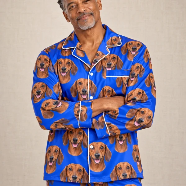 Man posing in mens dachshund pajamas, red smooth-coated Dachshund faces on royal blue satin — MyDogPics