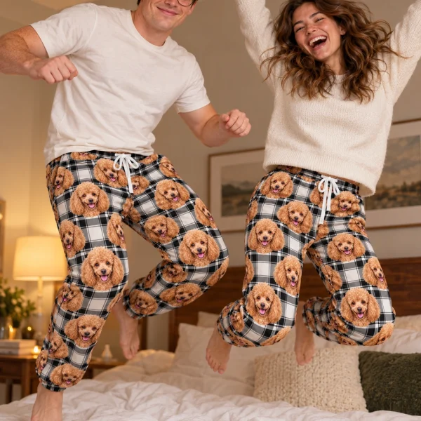 Man and his partner in matching poodle pajama pants with apricot Poodle faces on white plaid fabric — MyDogPics
