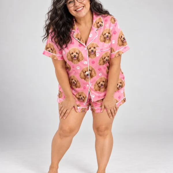 Woman wearing a poodle pajama short set covered in apricot Poodle faces on pink paw-print satin — MyDogPics