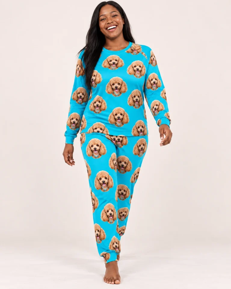 Woman wearing a poodle pajamas for adults covered in apricot Poodle faces on teal fabric — MyDogPics