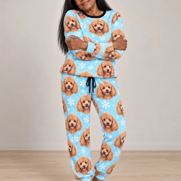 Woman wearing poodle winter pajamas covered in apricot Poodle faces on light blue snowflake fabric — MyDogPics