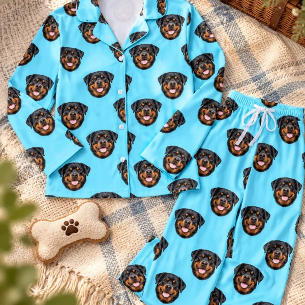 Flat lay of rottie pajamas: shirt and pants covered in black-and-mahogany Rottweiler faces — MyDogPics