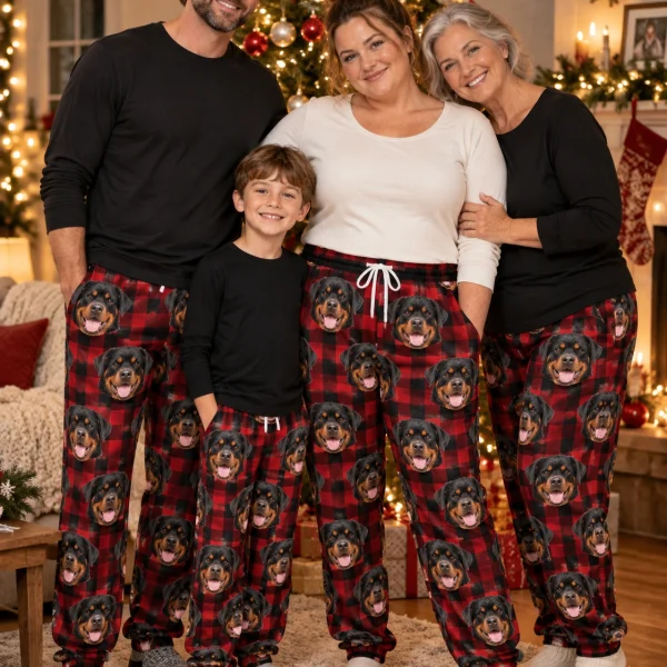 Woman and her family in matching rottweiler Christmas pajama pants with black-and-mahogany Rottweiler faces — MyDogPics