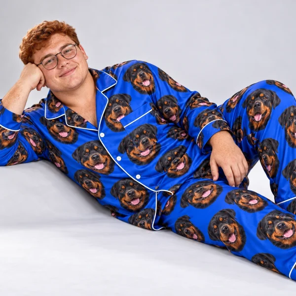 Man posing in a rottweiler pajamas for men, black-and-mahogany Rottweiler faces on royal blue satin — MyDogPics