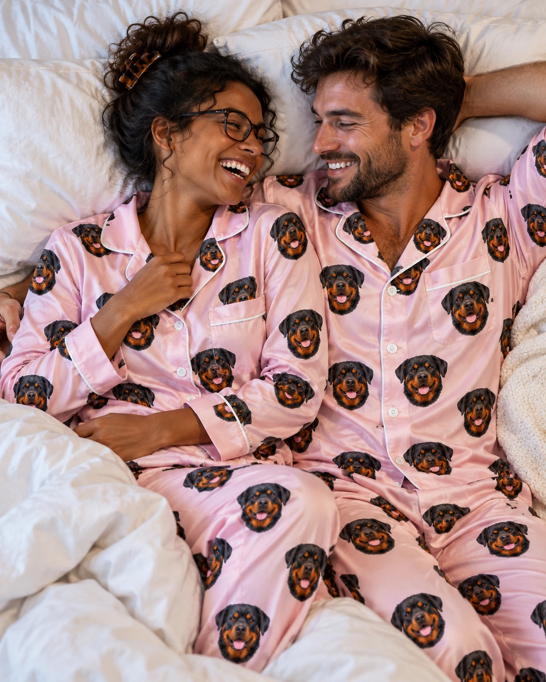 Rottweiler Pajamas for Women – Family, Blush Pink | MyDogPics Woman and her partner in matching rottweiler pajamas for women with black-and-mahogany Rottweiler faces — MyDogPics