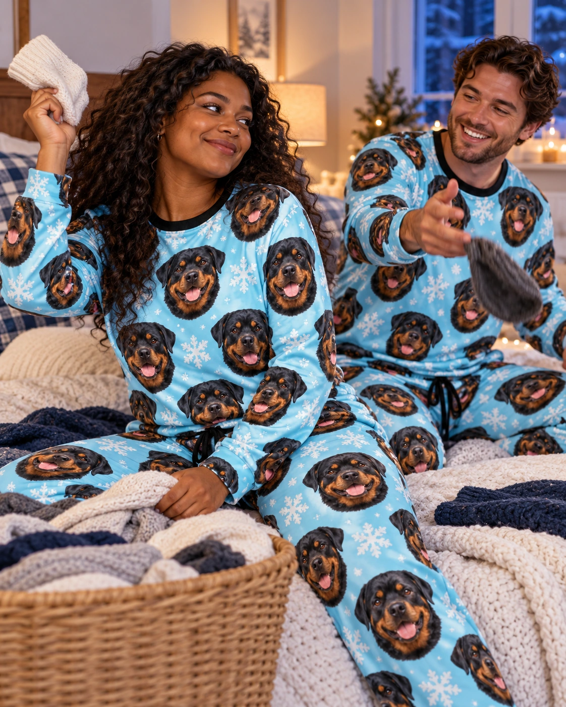 Rottweiler Winter Pajamas – Family, Light Blue Snowflake | MyDogPics Woman and her partner in matching rottweiler winter pajamas with black-and-mahogany Rottweiler faces — MyDogPics