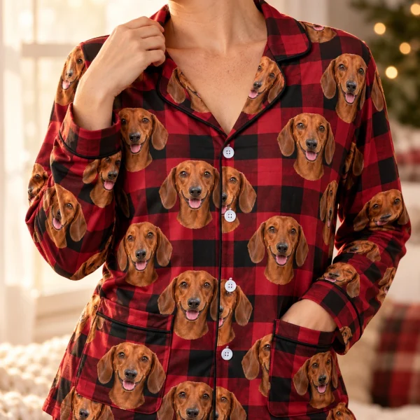 Close-up of the wiener dog Christmas pajamas print: red smooth-coated Dachshund faces on red plaid fabric — MyDogPics