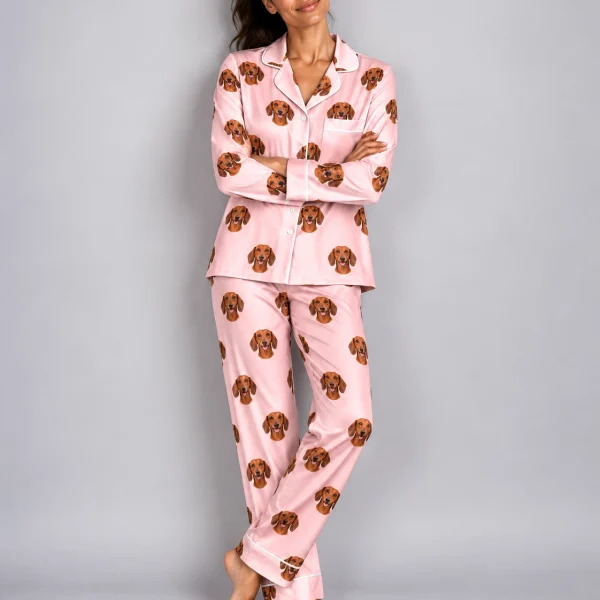 Woman wearing womens dachshund pajamas covered in red smooth-coated Dachshund faces on blush pink satin — MyDogPics