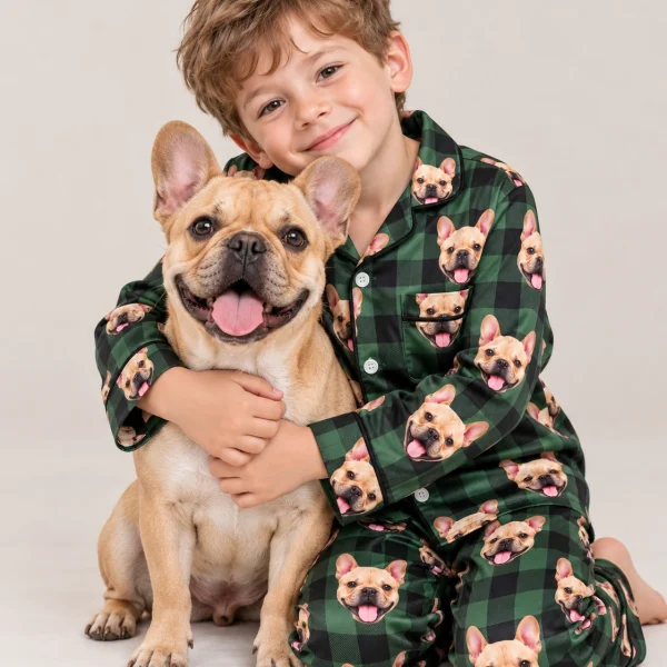 Boy in youth Christmas pajamas cuddling his French bulldog — MyDogPics